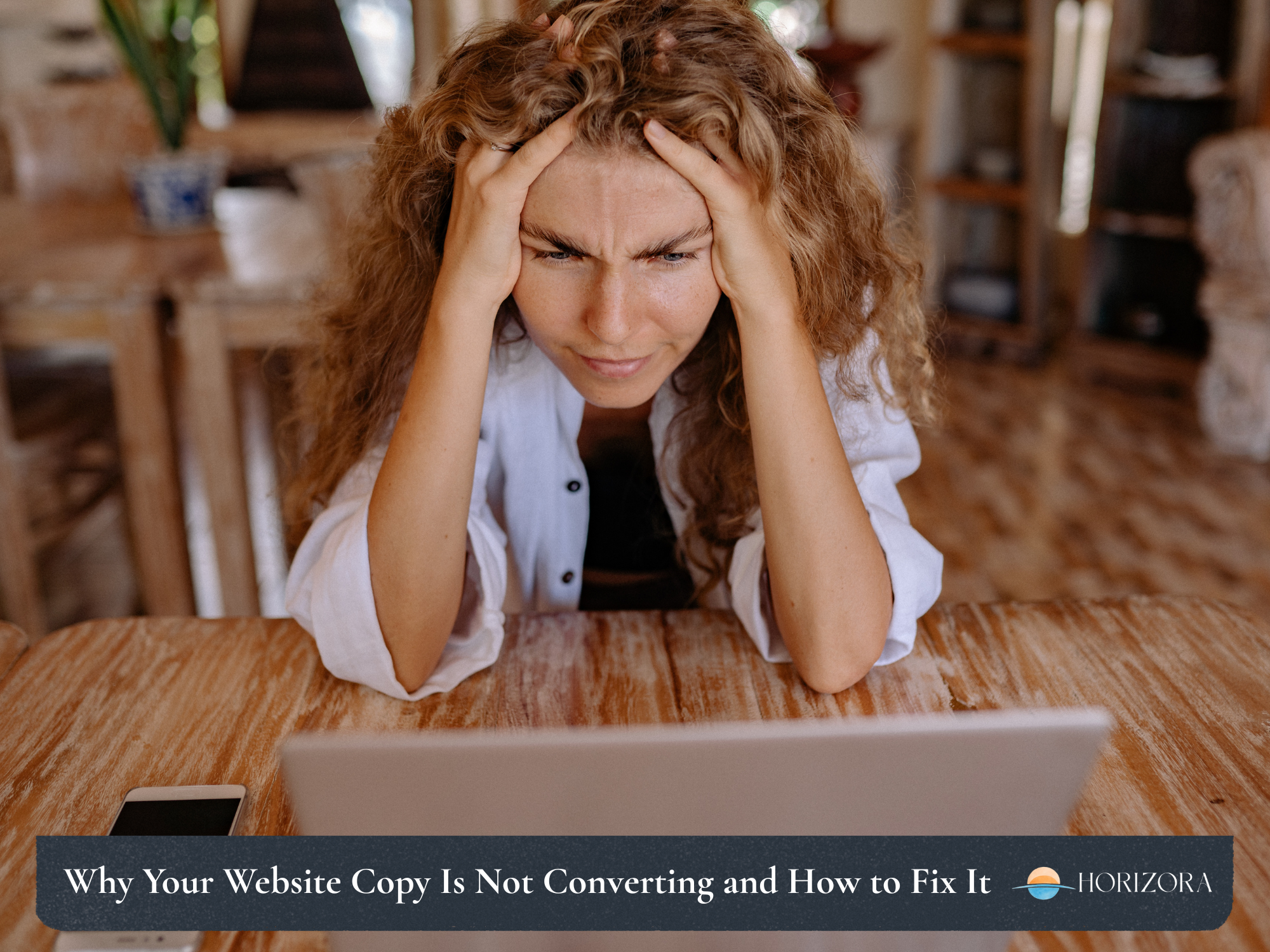 Small business owner looking at their website on a laptop wondering why it is not generating enquiries